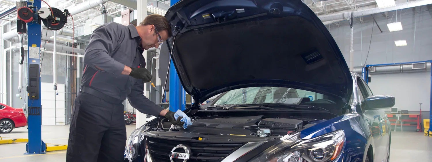 service tech working on car Nissan of Paducah in Paducah KY